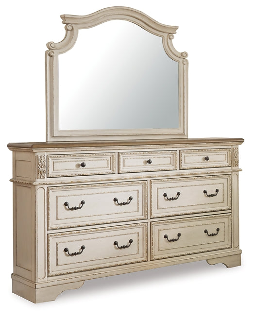 Realyn Upholstered Panel Bed With Mirrored Dresser And Chest