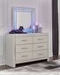 Zyniden King Upholstered Panel Headboard with Mirrored Dresser